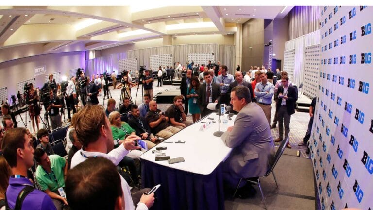 photo of cell phones superimposed over a crowd of sports fans