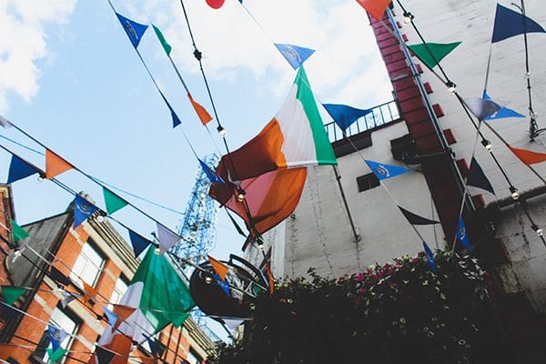 flags blowing above old buildings