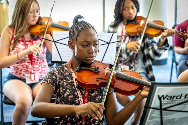 Summer Music Clinic student playing a violin