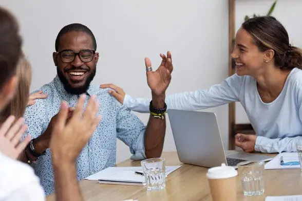 Enthusiastic team congratulating each other