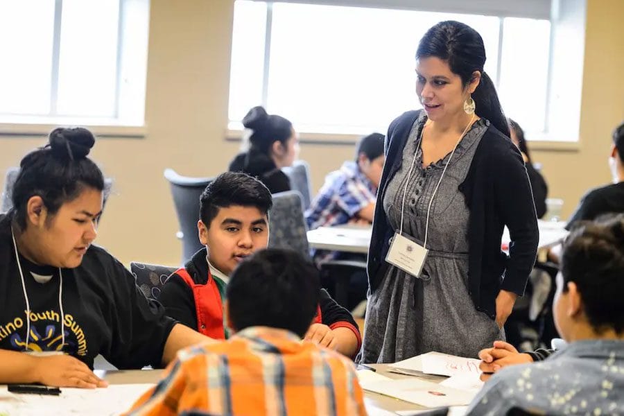 Latino Youth Summit teacher with her students