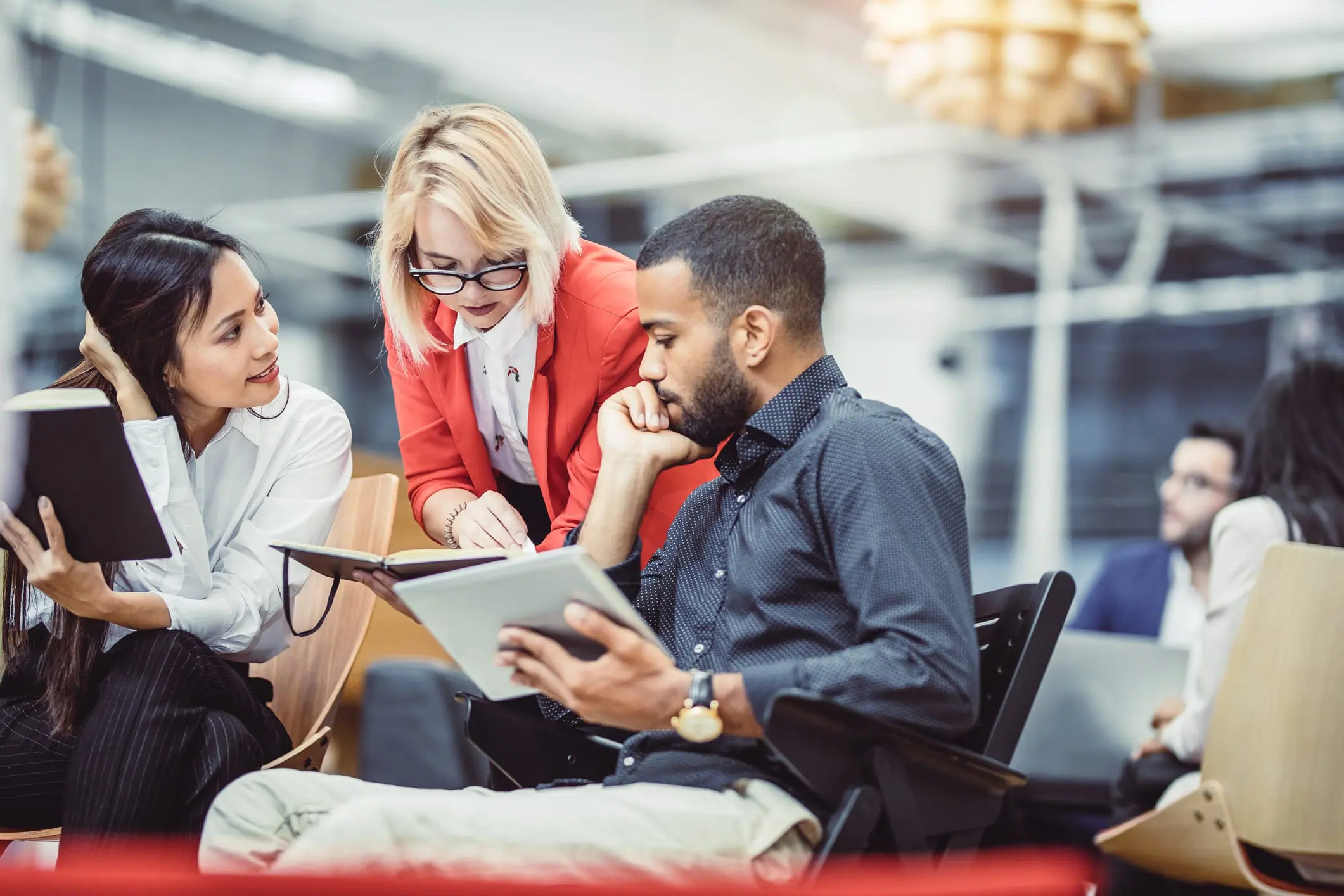 Business people speaking with an advisor.