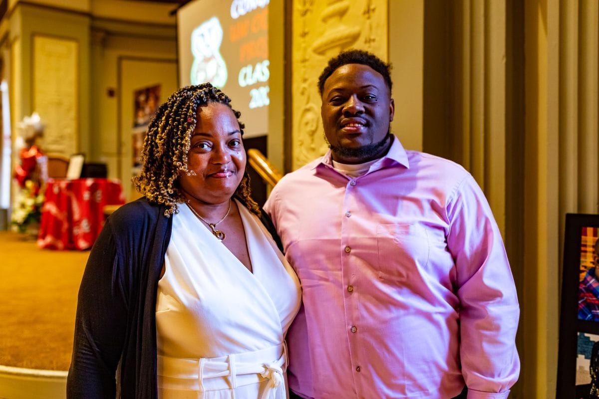 Mother and son Ericka and Jermaine Booey, both Odyssey '22 graduates, pose together at the graduation ceremony at UW–Madison.