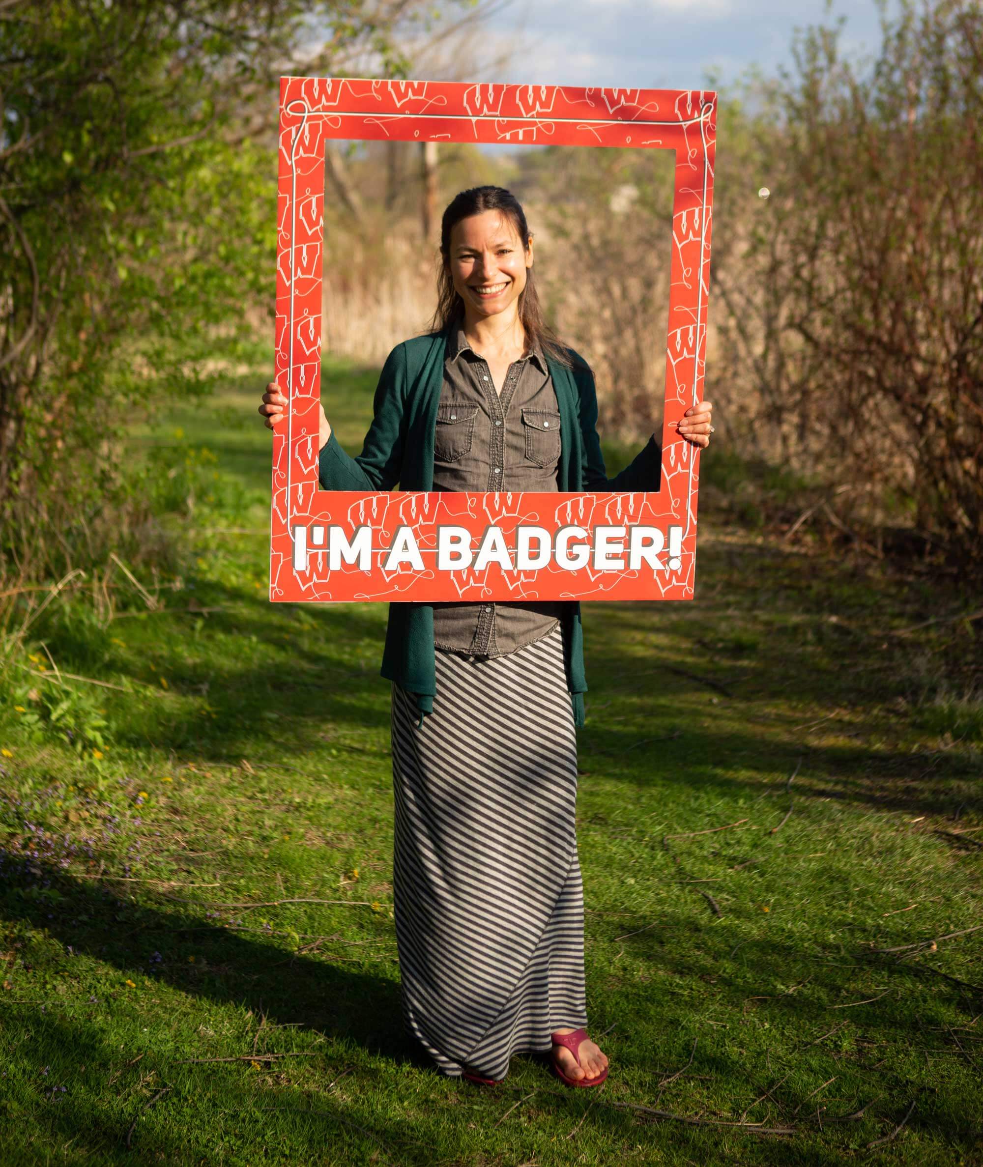 Student Janel Hutchison looking through a Bucky Badger frame