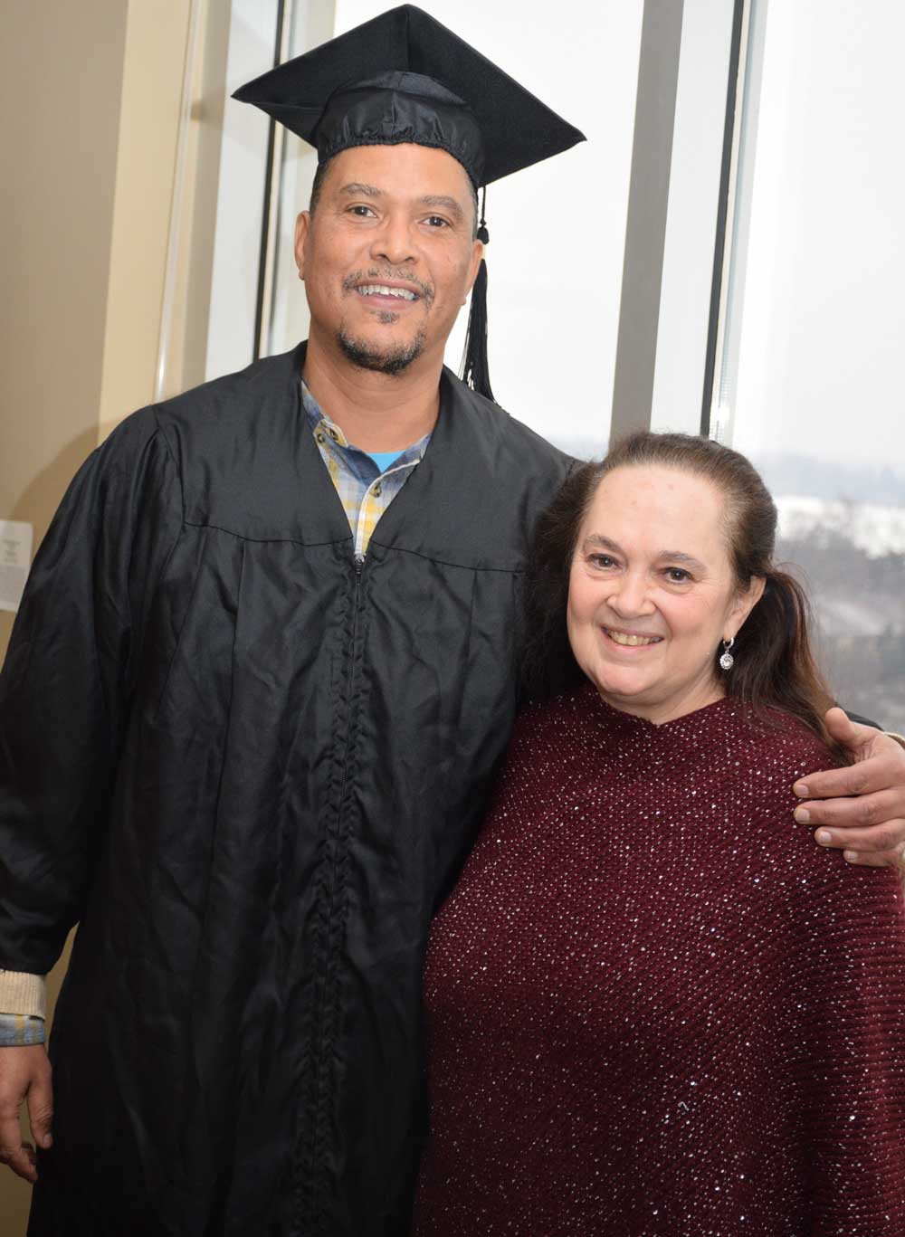 Brian Benford in cap and gown with Emily Auerbach