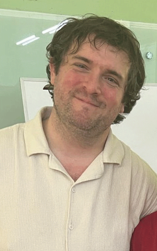 headshot of Robert Hall, smiling