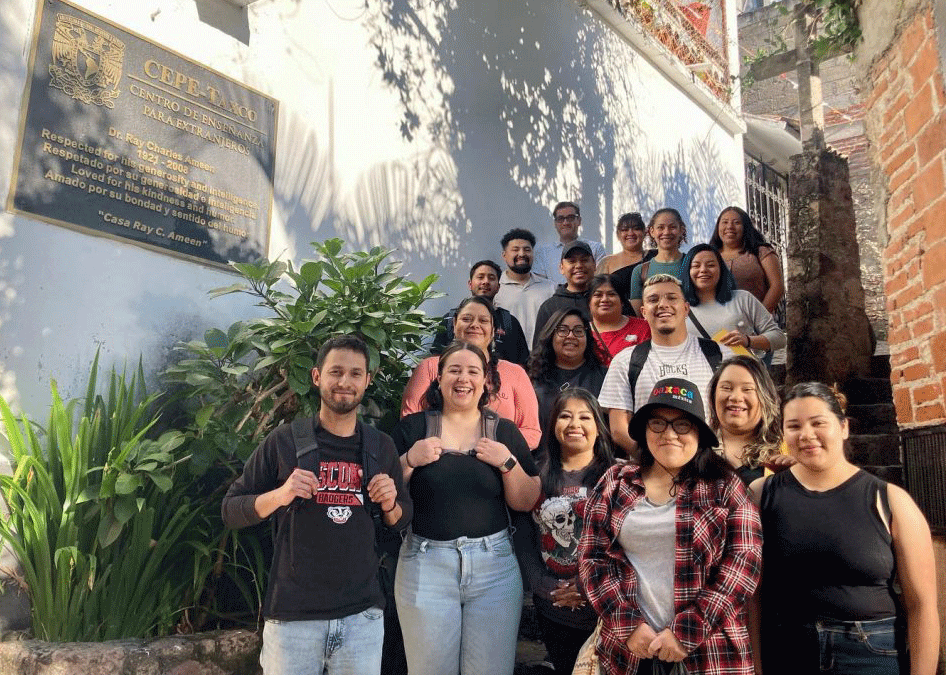 misol students standing next to a branch of the UNAM Mexican university