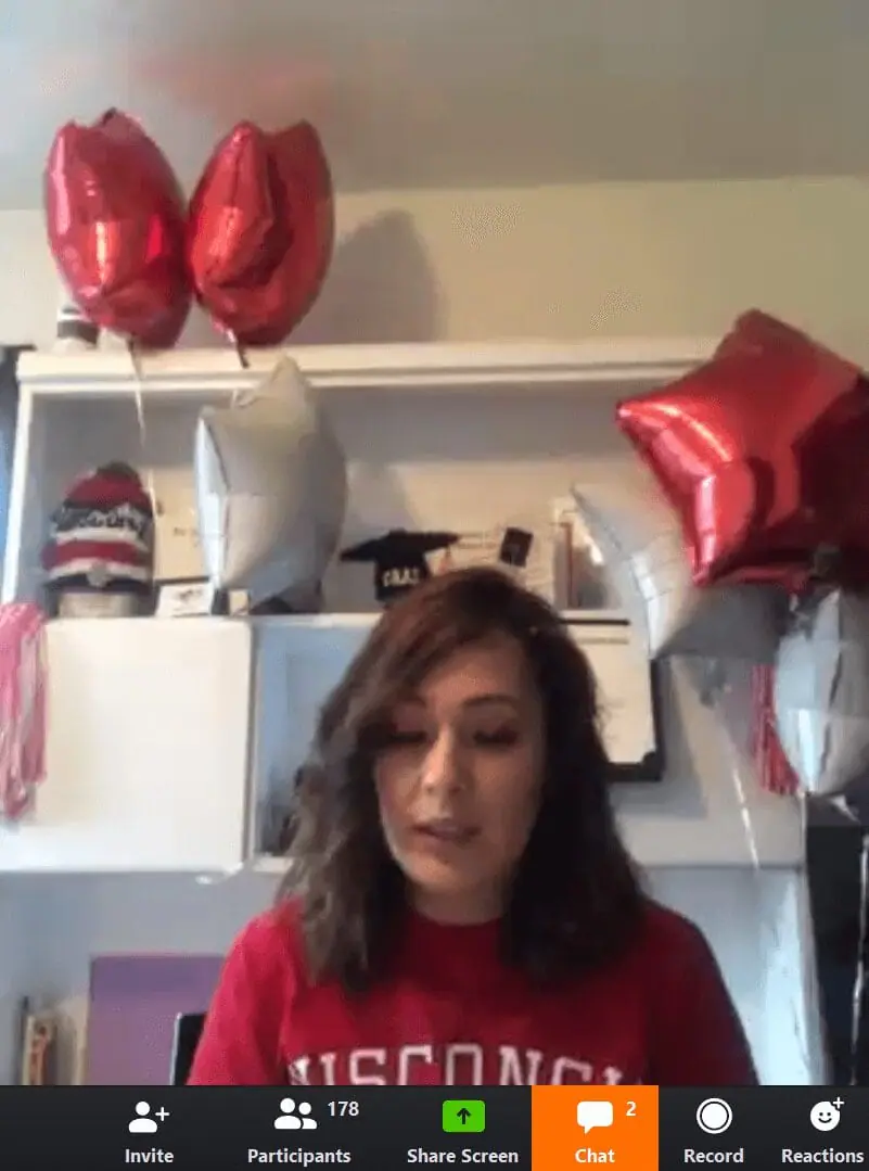 screenshot from Odyssey virtual graduation showing student giving a speech with balloons in the background