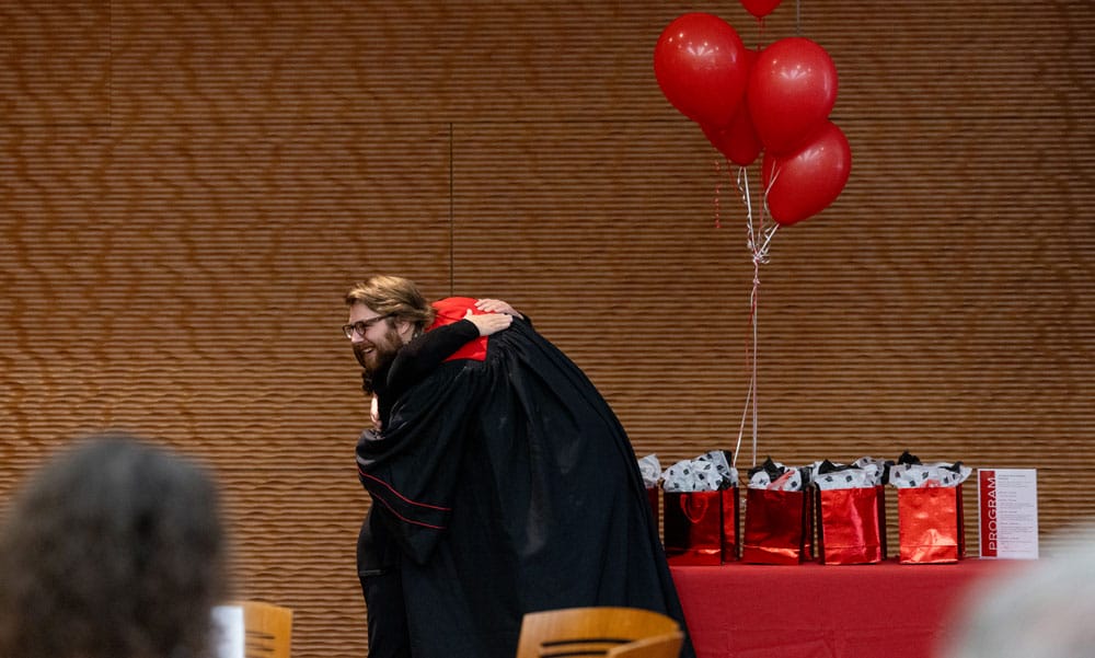 Troy in his graduation gown