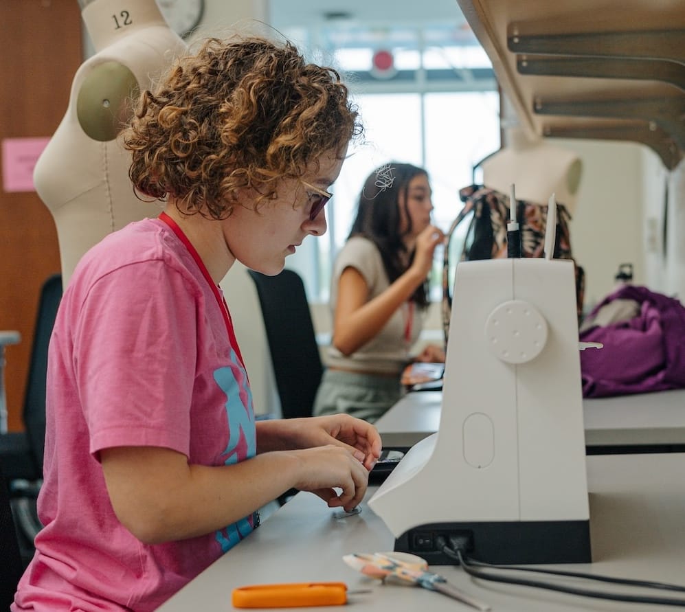 Rosemary Walsh works on a fashion show project for the streetwear and sustainable style class.