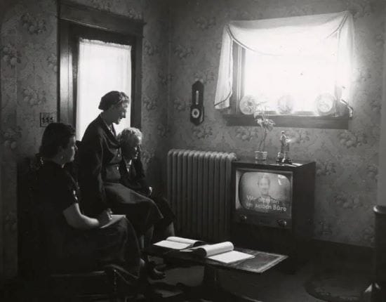 Three women watching the UW-Extension’s noncredit foreign language course on television