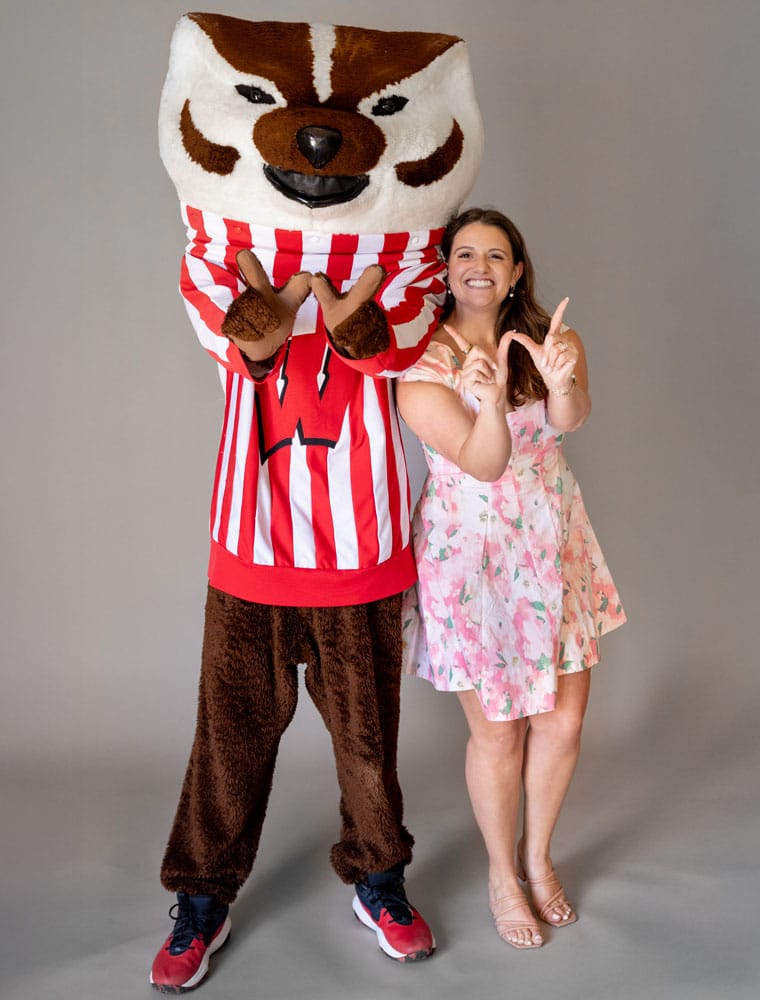 Jordan Hynum posing with Bucky Badger