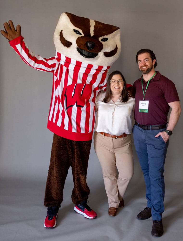 Doug Kieler posing for a picture with Bucky Badger