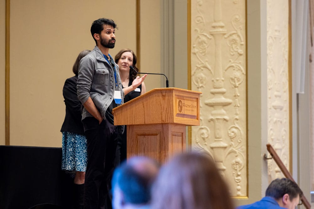 Graduate Avenash Pernankil giving a speech