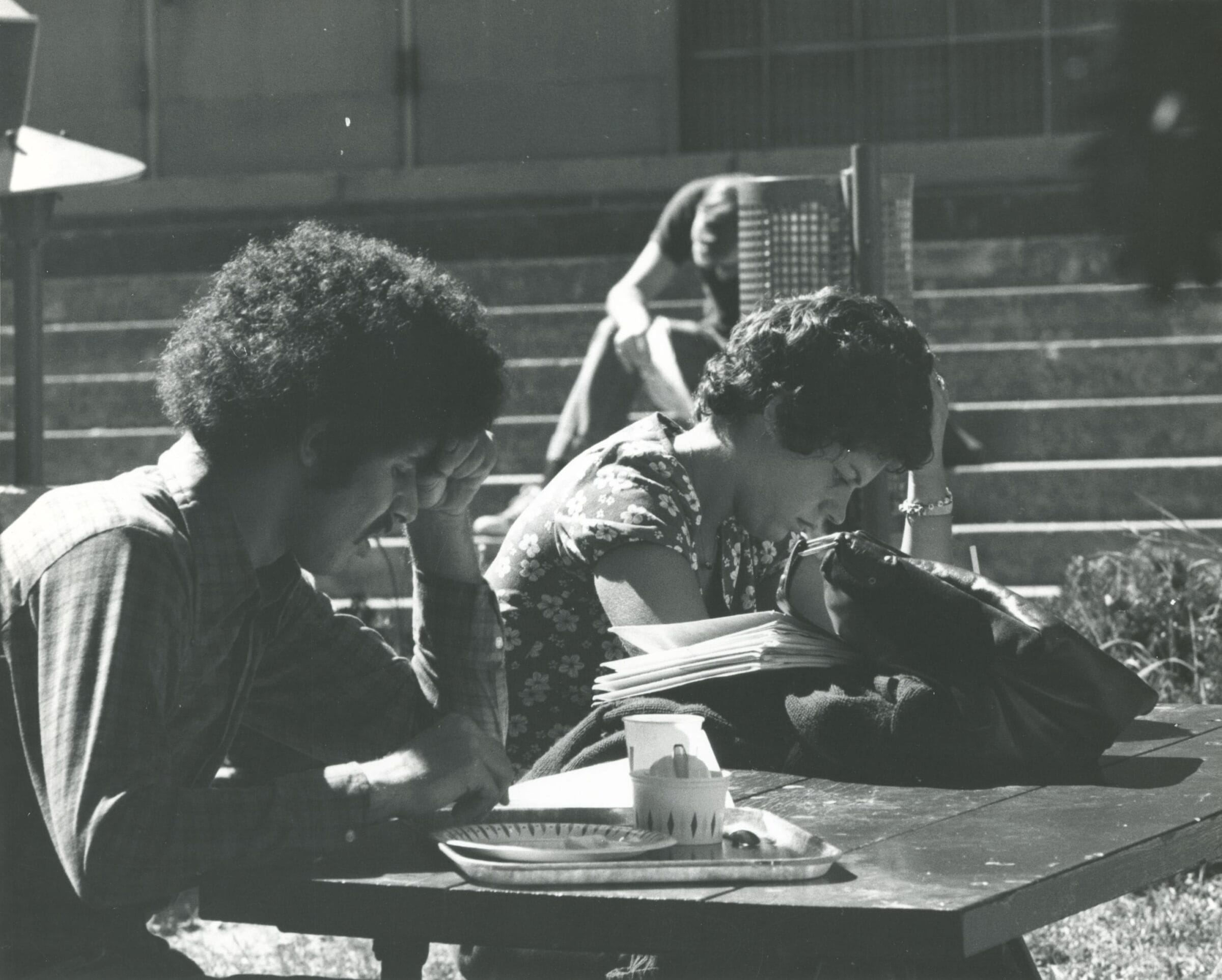 Two students studying outside.