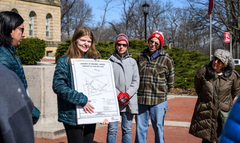 Tour leaders Kane Funmaker, undergraduate student and Ho-Chunk Nation tribal member, and Abbey Woldt, undergraduate student and Ho-Chunk Nation tribal member, speak to participants during a First Nations Cultural Landscape Tour