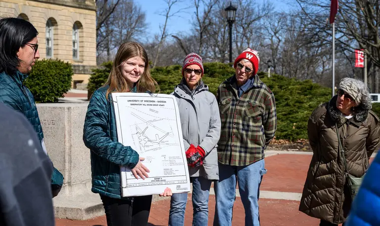 Tour leaders Kane Funmaker, undergraduate student and Ho-Chunk Nation tribal member, and Abbey Woldt, undergraduate student and Ho-Chunk Nation tribal member, speak to participants during a First Nations Cultural Landscape Tour