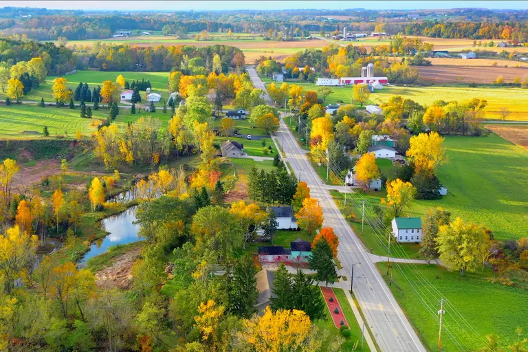 Aerial view of a small town in rural Wisconsin, with colorful fall foliage