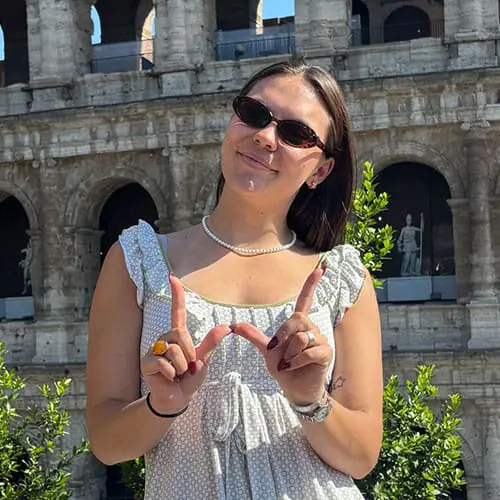 Student Morgan Ramsey posing in front of the colosseum