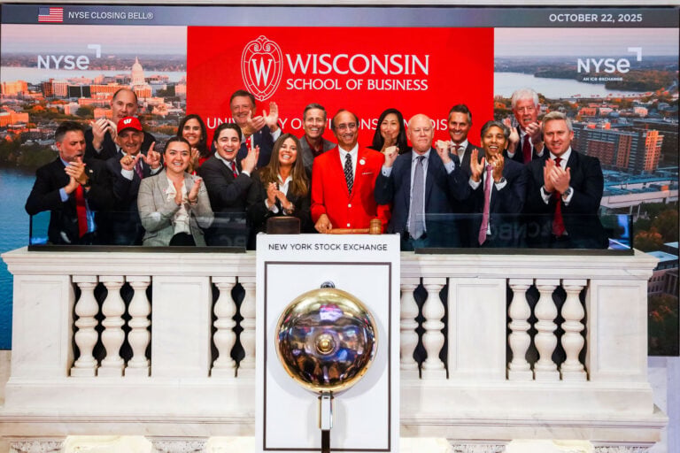As the clangs of the closing bell ring out, the 16 Badgers on the podium clap and cheer for WSB, its 125th anniversary, and its status as a growing force in global finance.