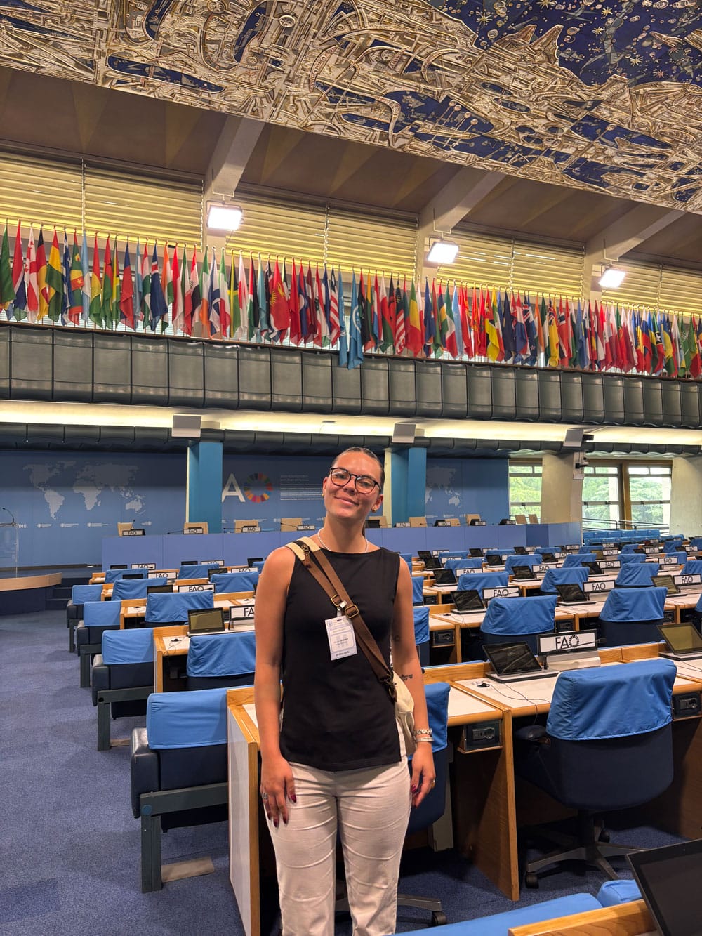 Morgan Ramsey stands in an international meeting room at the FAO