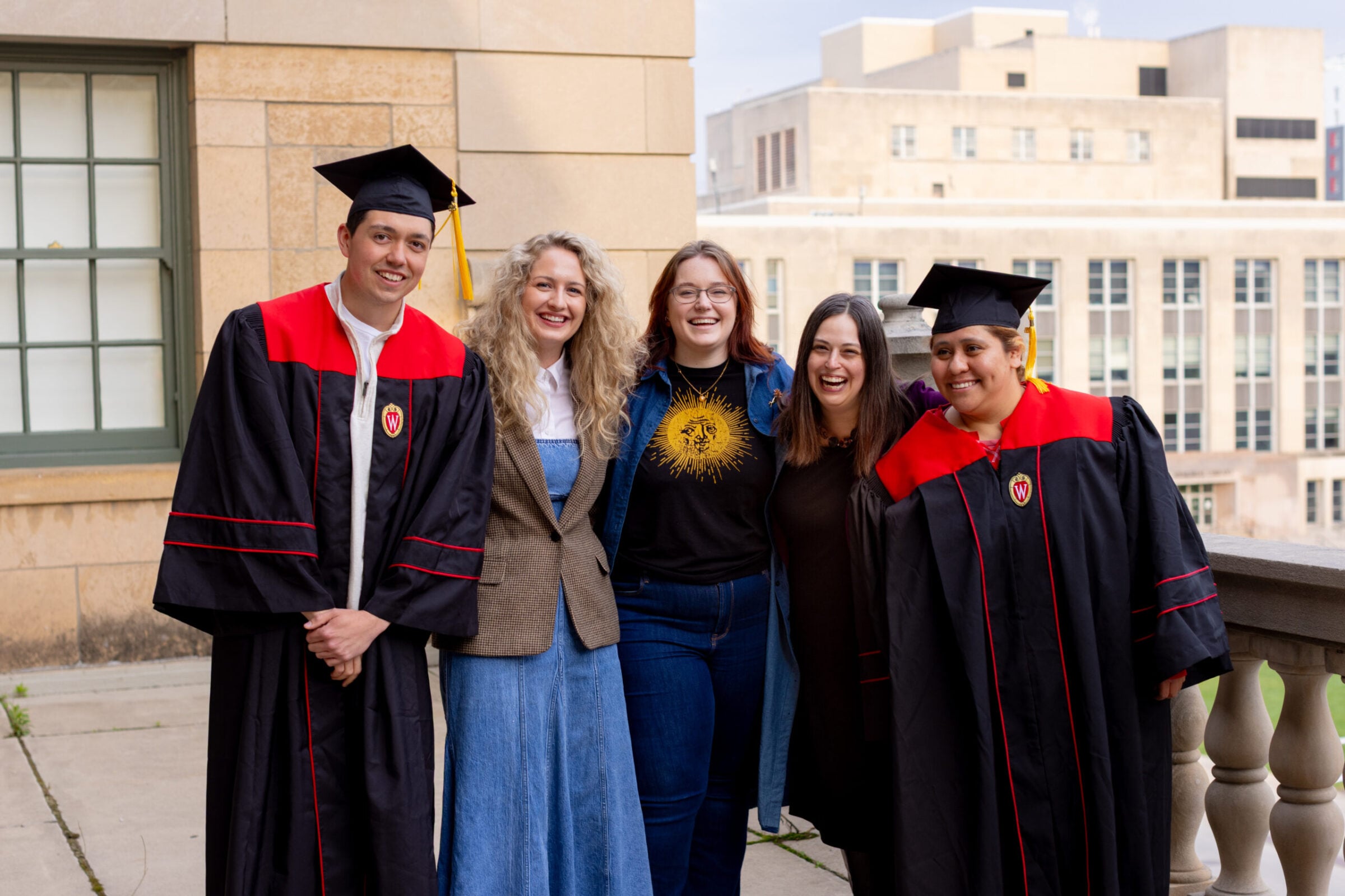 UW-Madison Online graduates posing for pictures with their family