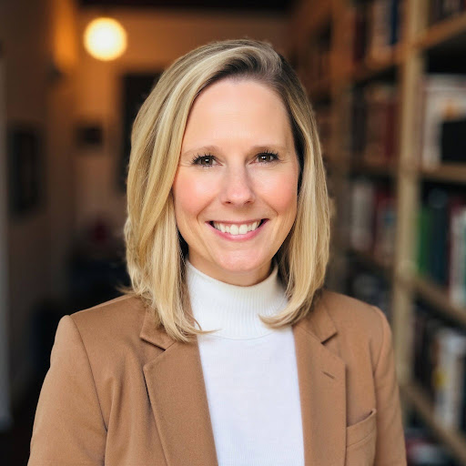 Headshot of Kristin O’Dell in a tan blazer